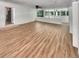 Spacious living room with hardwood floors, white brick walls, and natural light at 710 Montclair Sw Dr, Smyrna, GA 30082