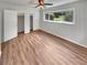 Cozy main bedroom with hardwood floors, neutral tones, ceiling fan, and closet at 710 Montclair Sw Dr, Smyrna, GA 30082