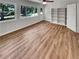 Spacious sun room with hardwood floors, built-in shelving, and natural light at 710 Montclair Sw Dr, Smyrna, GA 30082