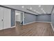 Finished basement with wood-look floors, and ample space perfect for recreation or storage at 747 Mill Rock St, Lawrenceville, GA 30044