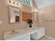 Bathroom with double sinks, tile flooring, modern vanity, and natural light at 747 Mill Rock St, Lawrenceville, GA 30044