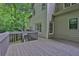 Expansive home deck with wooden railing offering views of the surrounding trees at 747 Mill Rock St, Lawrenceville, GA 30044