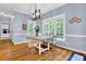 Charming dining area with hardwood floors and a stylish chandelier at 747 Mill Rock St, Lawrenceville, GA 30044