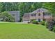 Traditional brick home with a large front yard and mature landscaping at 747 Mill Rock St, Lawrenceville, GA 30044