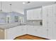 Well-lit kitchen with ample counter space and cabinetry at 747 Mill Rock St, Lawrenceville, GA 30044