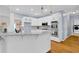 Bright kitchen with stainless steel appliances, granite countertops, and hardwood flooring at 747 Mill Rock St, Lawrenceville, GA 30044