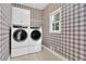Convenient laundry room with modern washer and dryer at 747 Mill Rock St, Lawrenceville, GA 30044