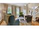 Bright and airy living room with hardwood floors, comfortable seating, and large windows at 747 Mill Rock St, Lawrenceville, GA 30044