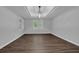 Bright living room with tray ceilings and wood-look floors and large windows offering great sunlight at 747 Mill Rock St, Lawrenceville, GA 30044