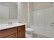 Bathroom featuring a vanity, mirror, toilet and shower-tub combo at 1300 Hopkins Dr, Decatur, GA 30033