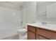 Bathroom with a combined tub and shower, a white vanity, and neutral walls at 1300 Hopkins Dr, Decatur, GA 30033