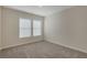 Neutral bedroom featuring carpet floors, windows and light walls at 1300 Hopkins Dr, Decatur, GA 30033