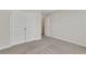 Carpeted bedroom with large closet doors and neutral paint at 1300 Hopkins Dr, Decatur, GA 30033