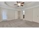 Bedroom featuring neutral walls and carpet, with doors leading to the outside and other rooms at 1300 Hopkins Dr, Decatur, GA 30033