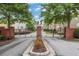 Gated community entrance with brick pillars, beautiful landscaping, and secure access at 1300 Hopkins Dr, Decatur, GA 30033