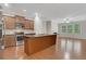 Open kitchen with stainless steel appliances, granite countertops, and a spacious center island at 1300 Hopkins Dr, Decatur, GA 30033