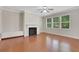 Inviting living room with a cozy fireplace, hardwood floors, and ample natural light at 1300 Hopkins Dr, Decatur, GA 30033