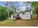 Exterior view of home with backyard, wooden deck and green lawn at 232 Apple Branch Dr, Woodstock, GA 30188