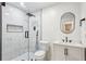 Modern bathroom with glass shower, sleek fixtures, and neutral tile at 232 Apple Branch Dr, Woodstock, GA 30188