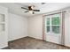 Neutral bedroom with a ceiling fan and a window with natural light at 232 Apple Branch Dr, Woodstock, GA 30188