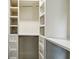 Custom closet with shelving and drawers, providing ample storage space at 232 Apple Branch Dr, Woodstock, GA 30188