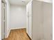 Hallway with wood floors and a large storage cabinet at 232 Apple Branch Dr, Woodstock, GA 30188