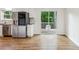 Bright kitchen with stainless appliances, subway tile backsplash and view of the backyard at 232 Apple Branch Dr, Woodstock, GA 30188
