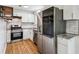 Modern kitchen with stainless steel appliances, white cabinets, and subway tile backsplash at 232 Apple Branch Dr, Woodstock, GA 30188