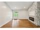 Bright, open living space with modern fireplace and access to the backyard at 232 Apple Branch Dr, Woodstock, GA 30188