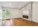 Bright, open living space with modern fireplace and access to the backyard at 232 Apple Branch Dr, Woodstock, GA 30188