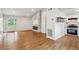 Spacious living room features a fireplace, wood floors, and a door leading to the outside at 232 Apple Branch Dr, Woodstock, GA 30188