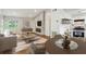 This open living space features recessed lighting, stone fireplace and kitchen at 232 Apple Branch Dr, Woodstock, GA 30188