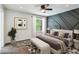 Carpeted main bedroom featuring modern decor and a wall with custom wood trim design at 232 Apple Branch Dr, Woodstock, GA 30188
