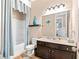 Cozy bathroom featuring a shower-tub combo and a single vanity at 411 Ridgeway Ln, Canton, GA 30114