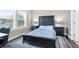 Serene bedroom featuring a decorative headboard, a ceiling fan, and neutral decor at 411 Ridgeway Ln, Canton, GA 30114