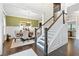 Elegant dining room featuring dark hardwood floors and staircase at 411 Ridgeway Ln, Canton, GA 30114