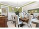 Elegant dining room featuring wainscoting, designer lighting, and seating for six at 411 Ridgeway Ln, Canton, GA 30114