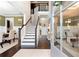 Bright foyer showcasing hardwood floors, a staircase with dark wood railings, and an open layout at 411 Ridgeway Ln, Canton, GA 30114