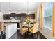 Cozy kitchen nook featuring a round table, wicker chairs, and bright window light at 411 Ridgeway Ln, Canton, GA 30114