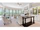 Bright and airy living room with a fireplace, large windows and neutral color palette at 411 Ridgeway Ln, Canton, GA 30114