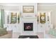 Cozy living room featuring a fireplace with built-in cabinets and elegant decor at 411 Ridgeway Ln, Canton, GA 30114