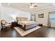 Spacious primary bedroom suite with hardwood floors and tray ceiling at 411 Ridgeway Ln, Canton, GA 30114