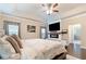 A main bedroom has a ceiling fan, recessed lighting, a fireplace, and access to the ensuite bathroom at 411 Ridgeway Ln, Canton, GA 30114