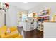 Bright craft room with great natural light, laminate flooring, and white shelves and cabinets at 411 Ridgeway Ln, Canton, GA 30114