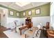 Charming sitting room with coffered ceiling, wainscoting and elegant furnishings at 411 Ridgeway Ln, Canton, GA 30114