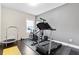 This spacious workout room features hardwood floors and plenty of equipment for exercise at 411 Ridgeway Ln, Canton, GA 30114