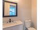 Modern bathroom with white vanity and framed mirror at 204 Elm St, Palmetto, GA 30268