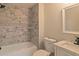 Remodeled bathroom with marble-look tile and modern fixtures at 204 Elm St, Palmetto, GA 30268