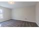Bedroom with carpet and window, bathed in natural light at 204 Elm St, Palmetto, GA 30268
