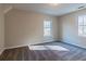 Bright bedroom features two windows and neutral carpeting at 204 Elm St, Palmetto, GA 30268